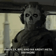 a man wearing a skull mask is sitting in a car with a gun .