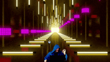 a man in a blue hooded jacket is playing a video game on a laptop