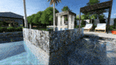 an artist 's impression of a swimming pool with a pergola and chairs