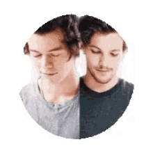 two men are standing next to each other in a circle and one of them is wearing a gray shirt .