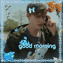 a picture of a man talking on a cell phone with the words " good morning " on the bottom