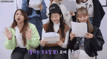 a group of girls are sitting in front of a white board with the words honeycam.org at the bottom
