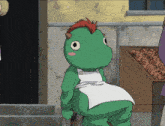 a green frog with horns and a white apron sits in front of a box of carrots