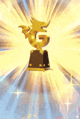 a golden trophy with the letter g on top of it