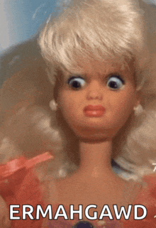 a close up of a barbie doll with the words ermahgawd above her