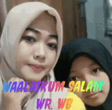 a woman and a child are posing for a picture and the words waalaikum salam wr wb are visible