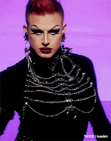 a close up of a drag queen 's face with t4yce tumblr in the bottom right corner