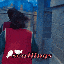 a picture of two people fighting with the words seallings in the bottom right corner