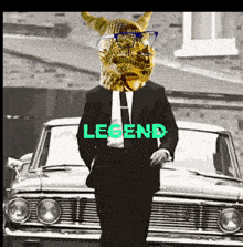 a man in a suit and tie is standing in front of a car with the word legend on it