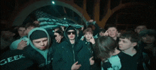 a group of young men wearing geek hats and hoodies