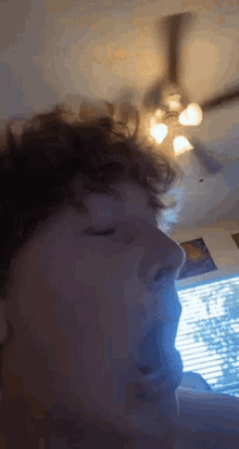 a close up of a person 's face with their mouth open