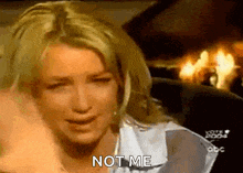 a woman is crying and saying not me .