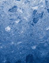 a close up of ice cubes on a blue background