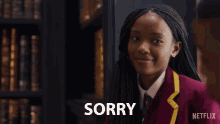 a woman says sorry in front of a man and a netflix logo