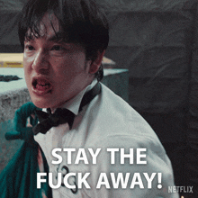a man in a tuxedo and bow tie says stay the fuck away netflix