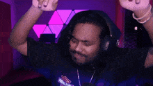 a man wearing headphones and a shirt that says harley davidson on it