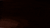 a shadow of a person is cast on a dark surface