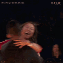 Hugging Family Feud Canada GIF - Hugging Family Feud Canada Embrace GIFs
