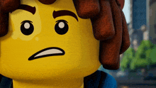 a close up of a lego character making a silly face