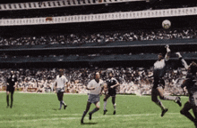 a soccer game is being played in a stadium with a sign that says ' a ' on it
