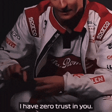 a man wearing a jacket that says i have zero trust in you on it