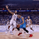 a basketball game between france and germany is being played on a court