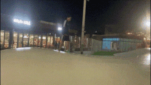 a blurred image of a person riding a skateboard in front of a building that says ' mcdonalds '