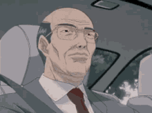 a bald man in a suit and tie is sitting in a car