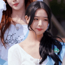 a close up of a girl wearing a white shirt that says rocket