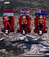 three cartoon figures are sitting on a podium with the number 2 1 and 3 on them