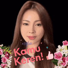 a woman with long hair is surrounded by pink flowers and the words kamu keren