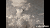 a man is flying through the air while holding a sword .