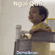 a little boy is crying while standing on a staircase .