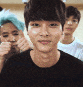 a group of young men are giving each other thumbs up