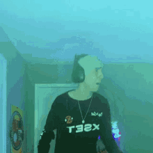 a person wearing headphones and a shirt that says t3ex