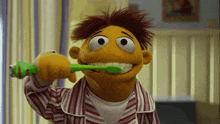 a stuffed animal brushing its teeth with a green toothbrush