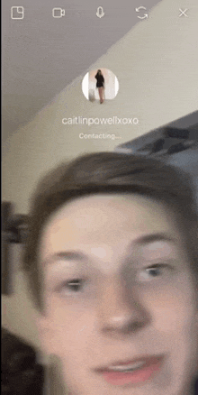 a close up of a person 's face with the name caitlinpowellxoxo written on it