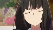 a close up of a girl 's face with closed eyes