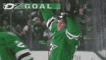 a hockey player wearing a green jersey with the number 2 on it