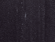 a man with a beard is looking at the camera with a lightning bolt coming out of his ear .