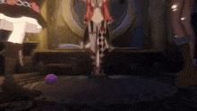 a woman in a harlequin outfit is standing in a room