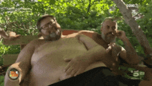 a man laying on another man 's stomach with giorno 27 on the bottom