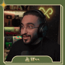 a man wearing glasses and headphones with a green frame around him with the number thirteen on it