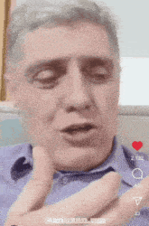 a close up of a man 's face with the words snazan.um on the bottom right