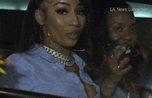 a woman with long yellow nails sticking her tongue out and the words la news connection behind her