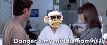 a man and a woman are talking and the man has a monkey on his head and the woman says danger 's my middle nam