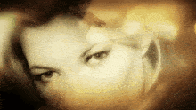 a woman 's face is shown in a blurry photo