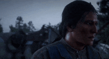 a man with a bow and arrow is standing in the dark .