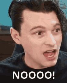 a close up of a man 's face with the word nooo written on it