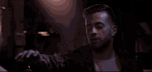 a blurry image of a person 's face with a blue light behind them